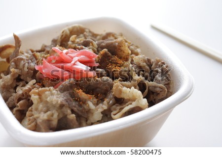 Take out Packed lunch of Sweet Soy Beef Fillet with  on Rice with chopsticks