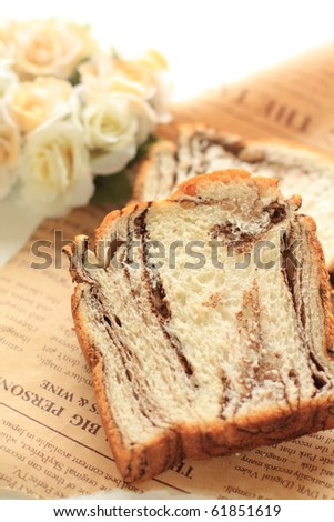 Home bakery chocolate bread styling with elegant rose bouquet