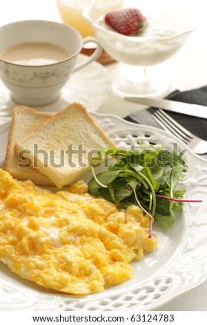 Scramble egg and toast, milk tea, strawberry yogurt, green salad.  Healthy Breakfast!