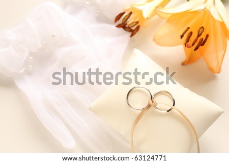 Wedding glove and ring styling with elegant lily