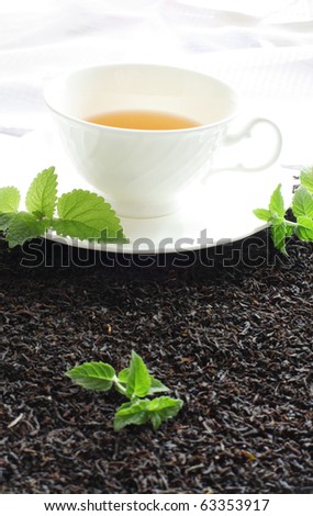 Ceylon Tea leave and hot tea styling with mint