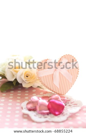 Pink heart shape chocolate and gift box with flower for Valentine's Day