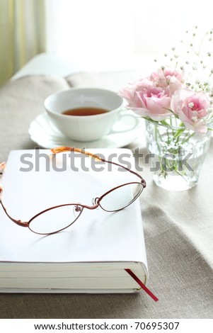Glasses and book