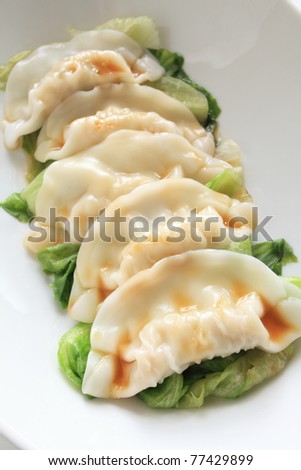 Chinese cusine, Gyoza dumpling with lettuce and sauce