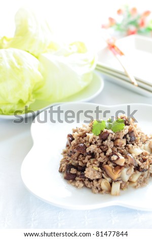 Chinese cuisine, lotus and mince stir fried with lettuce