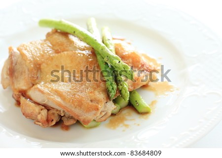 French cuisine, chicken sauteed with grilled asparagus and teriyaki sauce