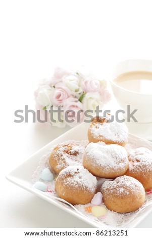 Lovely puff cream with hot English tea for elegance afternoon tea image