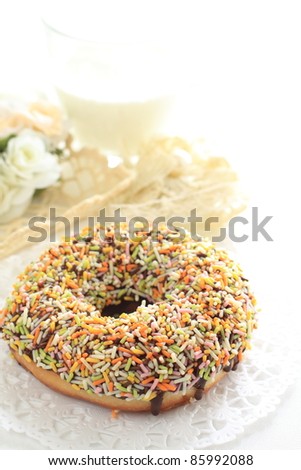 Sugar donut and milk on white background