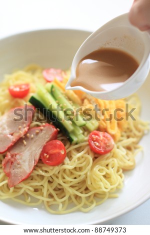 Chinese cuisine, summer cold noodles with vegetable and roasted pork
