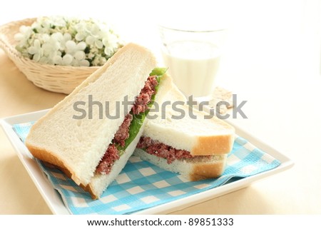 corned beef sandwich and milk for breakfast or tea break image