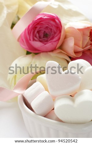 buttercups flowers and heart shape marshmallow