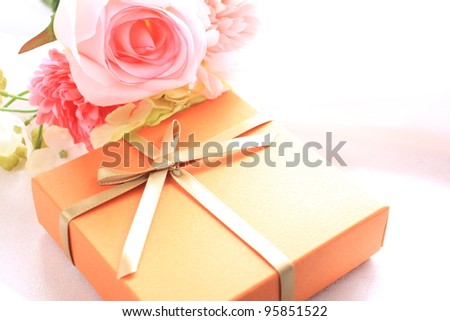 present and flower bouquet on silk