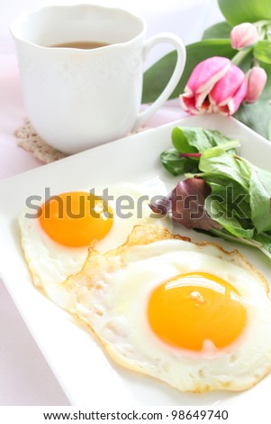 Sunny side up and baby leaves for breakfast