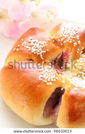 Japanese red bean bread with edible flower Cherry blossom for spring food image