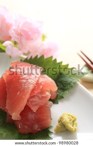 Japanese cuisine, Toro Tuna fish and  wasabi with flower on background