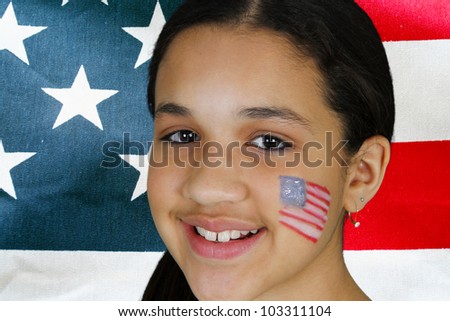 Teen girl has a flag painted on her face
