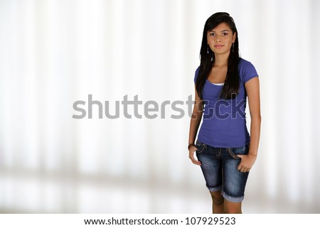 Teenage girl standing up in her home