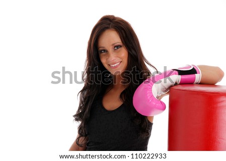 Woman boxing with a punching bag on white background