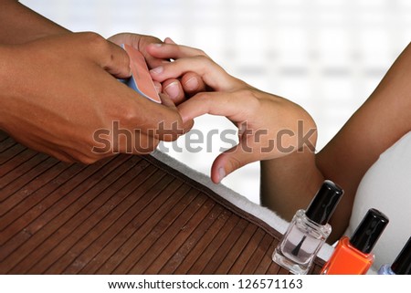Woman getting her nails done at a spa