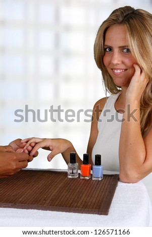 Woman getting her nails done at a spa