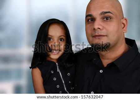Father and his daughter playing inside their home