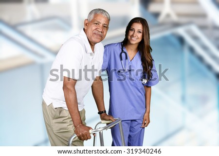 Nurse giving physical therapy to an elderly patient