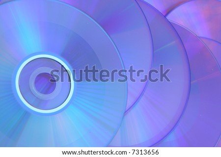 CD\'s that are used as a blue background