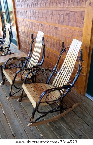 Rocking chairs sit on a porch
