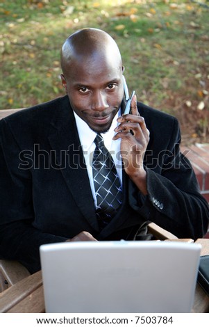 Young businessman outside dressed in a suit