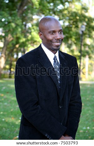 Young businessman outside dressed in a suit