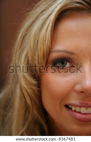 One side of a womans face from an up close perspective