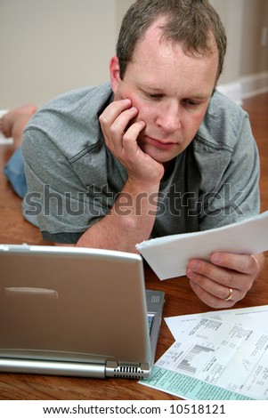 Man paying bills on the computer