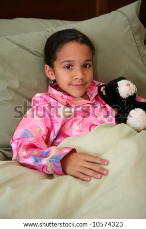 Girl laying in her bed ready to go to sleep