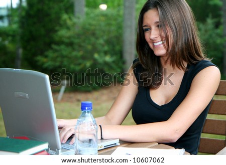 Young woman on her computer and studying