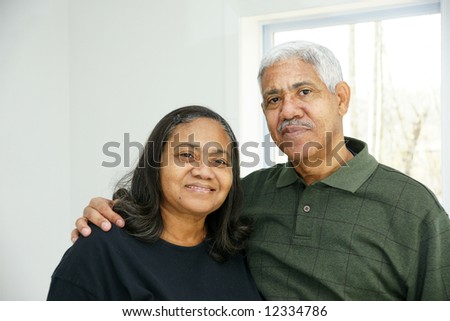 Senior man and woman ready together at home