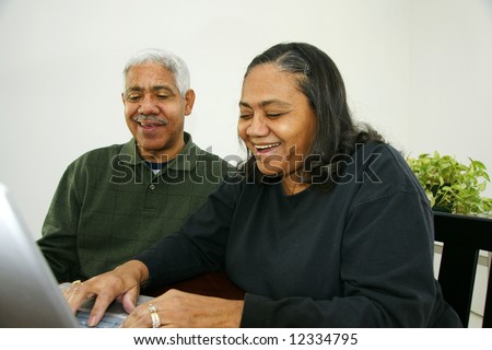 Senior man and woman ready together at home