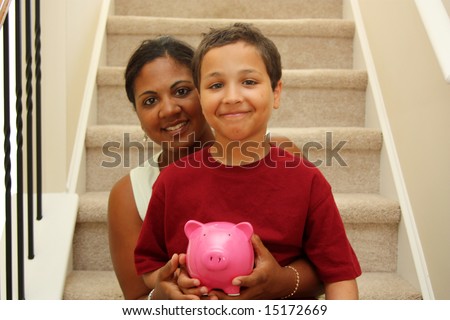 Woman and Son Holding Piggy Bank With Savings