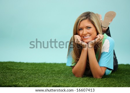Woman Laying Down Outside In The Grass