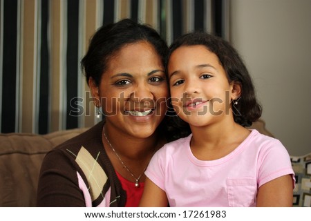 Mother and Daughter Sitting Together on the couch
