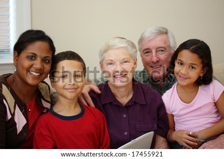 Grandparents together with their family at home
