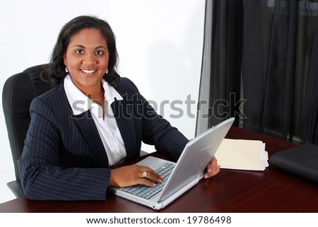 Woman in an office who is ready to work