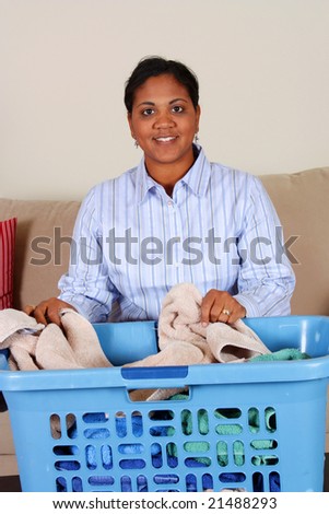 Woman doing the laundry in her home