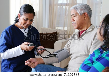 Home health care worker and an elderly couple