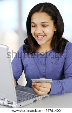 Picture of a child with computer set on white background