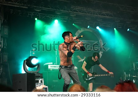 COLOGNE, GERMANY - JULY 19: singer Alex Moklebust of the norwegian band ZEROMANCER acting topless on the main stage of the AMPHI Festival July 19, 2008 in Cologne, Germany.