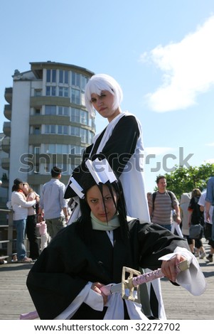 DUSSELDORF, GERMANY-JUNE 13: Two samurai fighter girls posing for the camera during the 8th Japan Celebration Day on June 13, 2009 in Dusseldorf, Germany.  It\'s the main Japanese event in Europe.