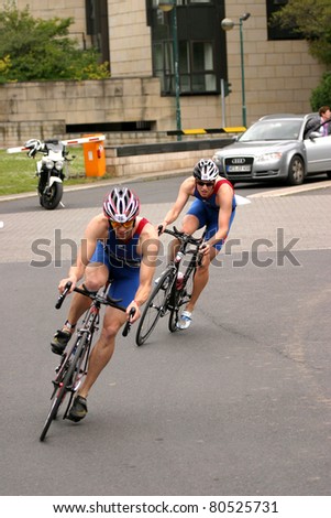 DUSSELDORF, GERMANY - JULY 03: unknown athletes trying to make pace in the second discipline, cycle race, in this years triathlon.July 03, 2011 in Dusseldorf, Germany.