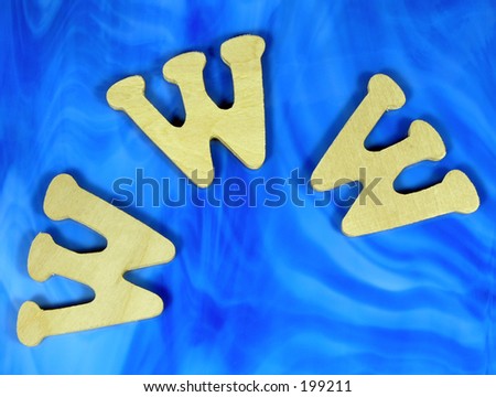 Carved wood www letters on blue glass
