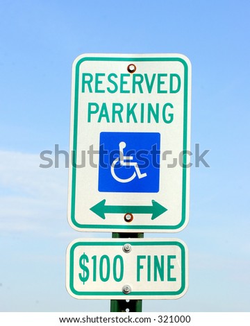 Reserved handicapped parking sign with $100 fine warning