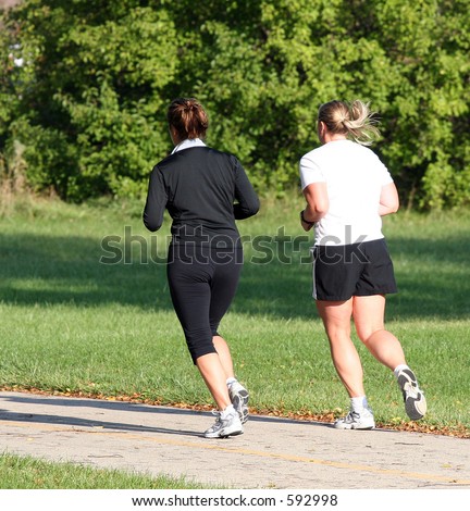 Two females jogging in the park